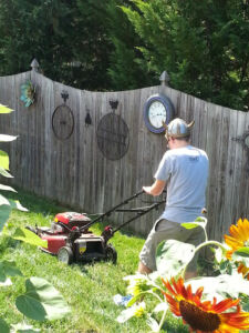 Mom told him to put on a hat while mowing the grass
